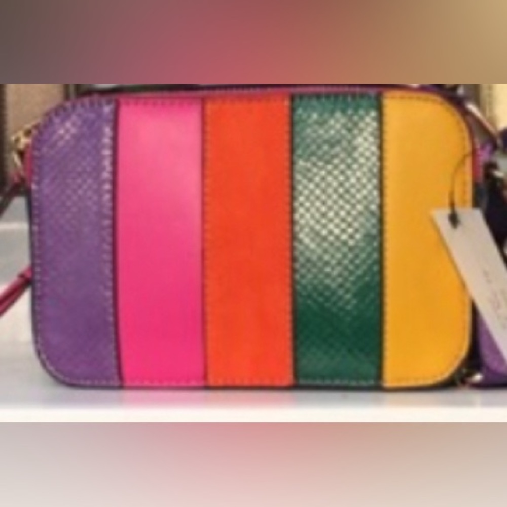 Multi-bright stripe crossbody with double zipper closure and adjustable strap.